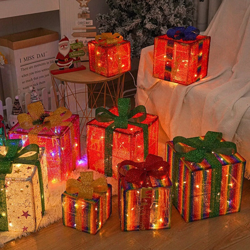 Decorative light-up gift boxes on a table with a festive background