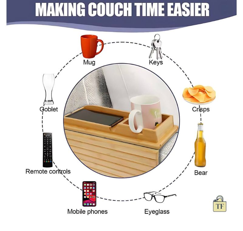 Couch armrest tray with items like mug, keys, crisps, bear, remote controls, goblet, mobile phone, eyeglasses, and a bag.