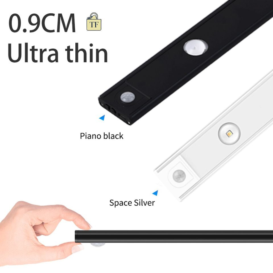 Two ultra-thin LED strips, one lamp black and one space silver, held by a hand on a white background.