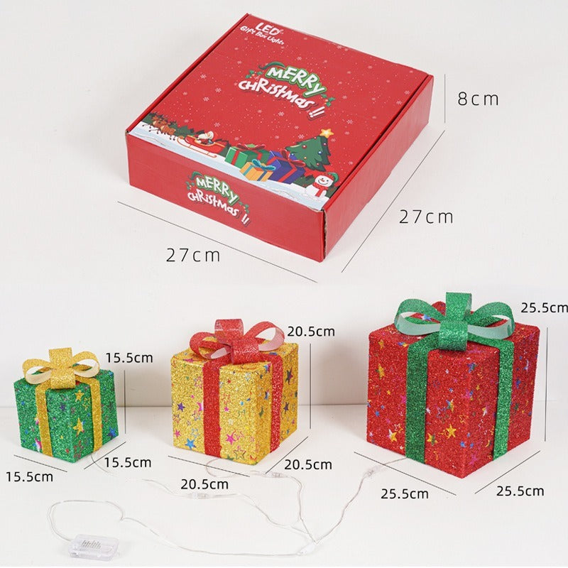 Red Christmas-themed gift box with measurements and smaller gift boxes on a white background