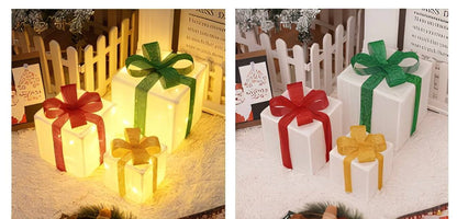 Decorative gift-shaped lights with colorful bows on a festive background.