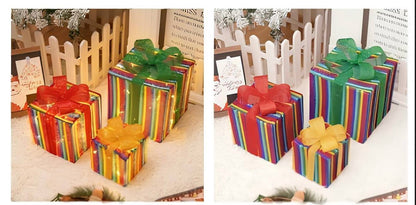 Colorful gift boxes with bows on a white surface.